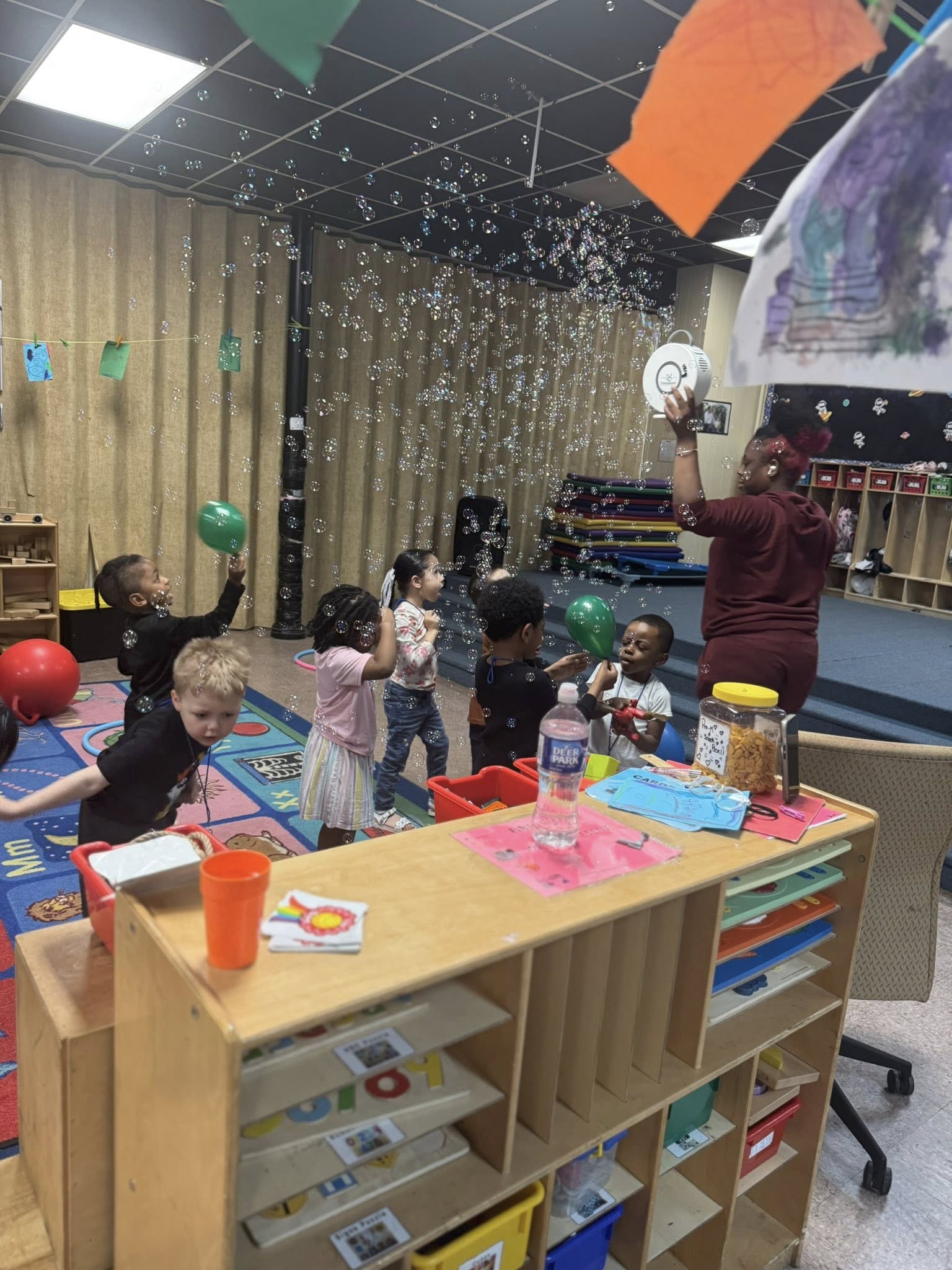 Teacher interacting with children in a quality early learning classroom